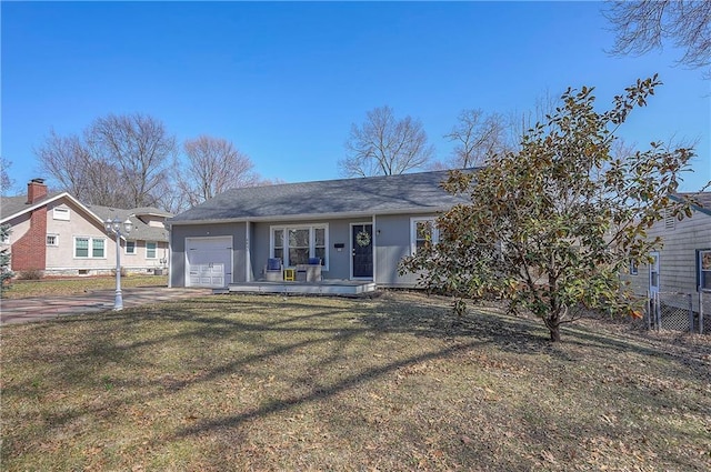 single story home with a garage, a front yard, and driveway