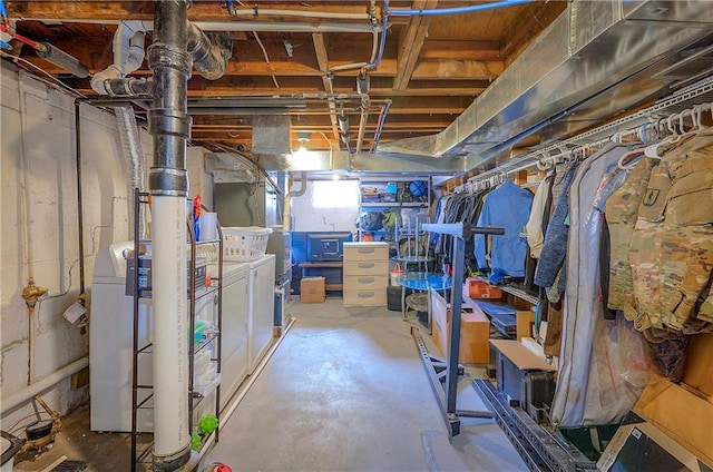 unfinished basement featuring independent washer and dryer