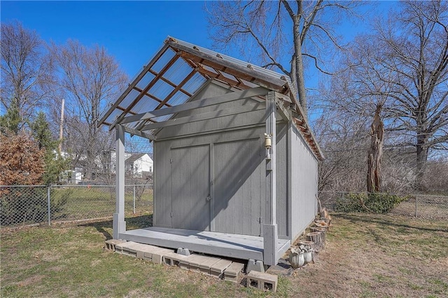 view of shed with a fenced backyard