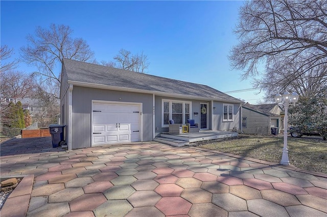 back of property with a garage