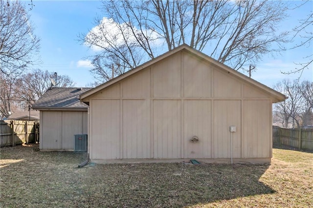 view of outbuilding with fence