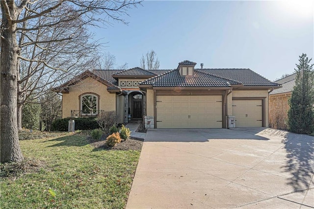 view of front facade featuring stucco siding, concrete driveway, a tile roof, and a garage