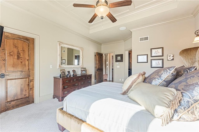 carpeted bedroom featuring ceiling fan, visible vents, a raised ceiling, and ornamental molding