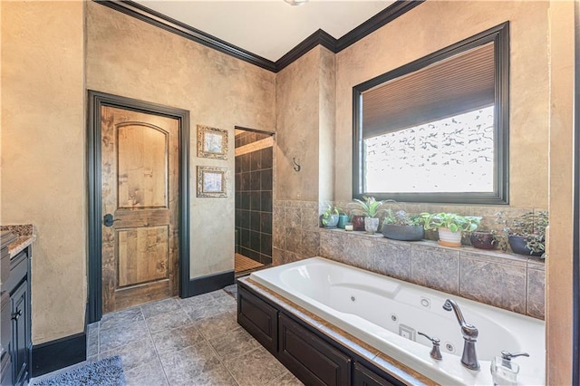 full bath with a tub with jets, vanity, and ornamental molding