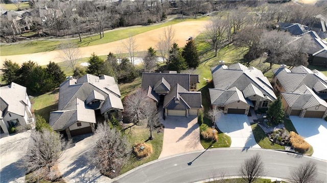 aerial view with a residential view and view of golf course