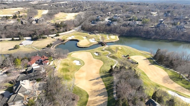 drone / aerial view featuring view of golf course and a water view