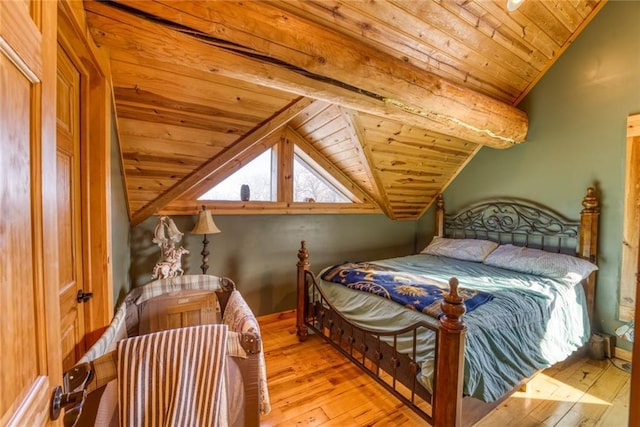 bedroom featuring baseboards, wood ceiling, light wood-style floors, and lofted ceiling