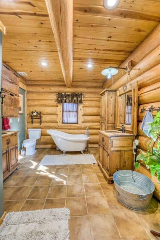 full bathroom with wood ceiling, toilet, a freestanding bath, recessed lighting, and vanity