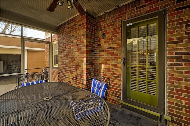 view of patio featuring outdoor dining area and a ceiling fan