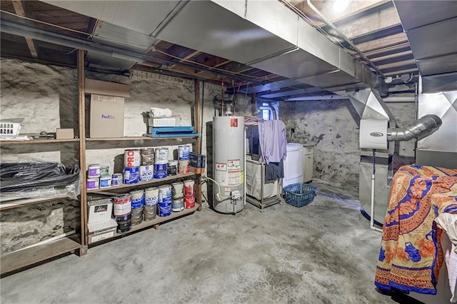 unfinished basement with water heater and washer / dryer