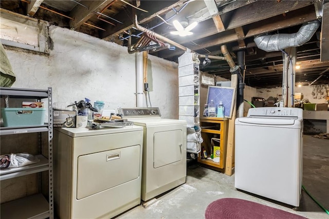 laundry room featuring laundry area and separate washer and dryer