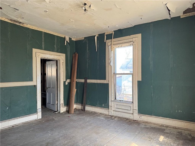 unfurnished room featuring wood-type flooring