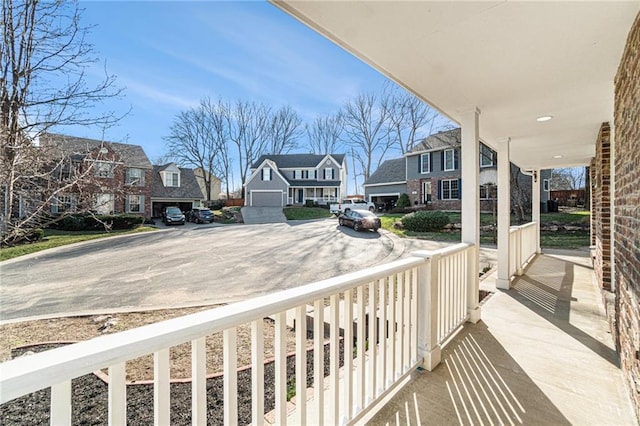 balcony featuring a residential view and a porch