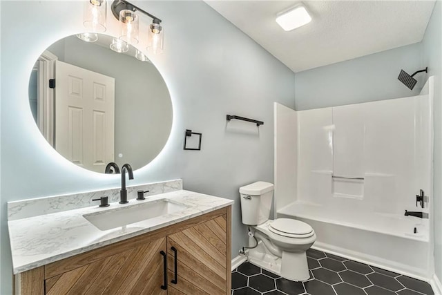 full bath with vanity, baseboards, bathtub / shower combination, tile patterned flooring, and toilet