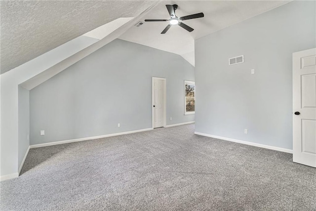 bonus room featuring visible vents, baseboards, carpet flooring, lofted ceiling, and ceiling fan