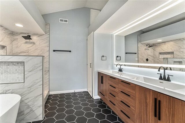 bathroom featuring visible vents, walk in shower, lofted ceiling, and a sink