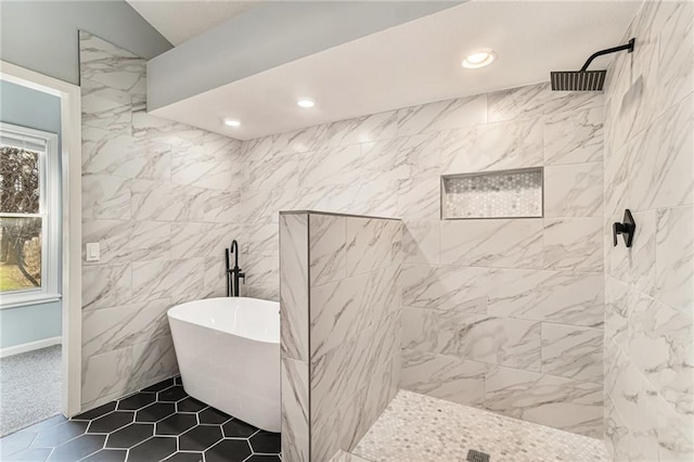 full bath with tile patterned flooring, recessed lighting, a freestanding bath, and tiled shower