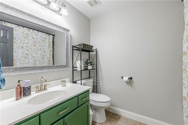 full bath with vanity, toilet, baseboards, and visible vents