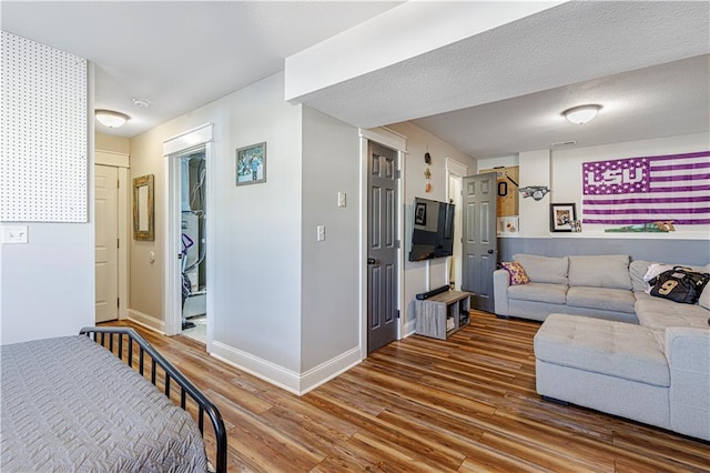 living room with wood finished floors and baseboards