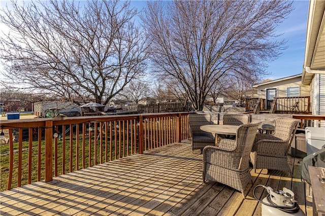 wooden deck with outdoor dining area