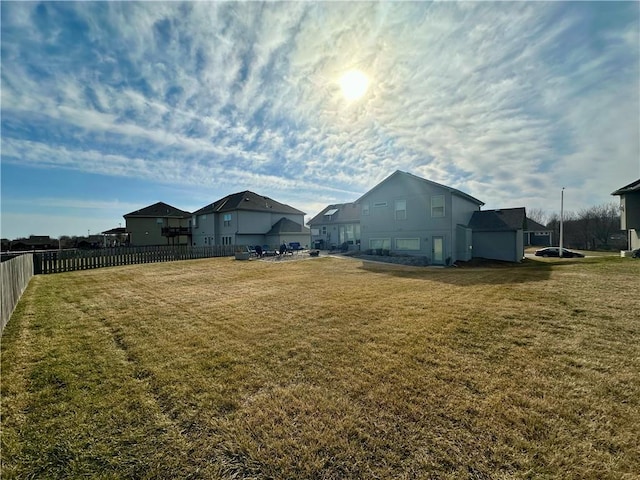 view of yard featuring a residential view and fence