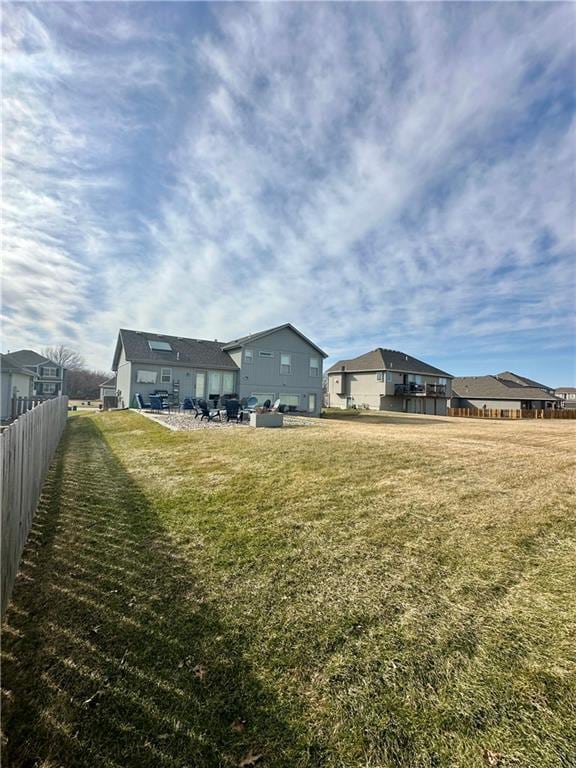 view of yard featuring a residential view and fence