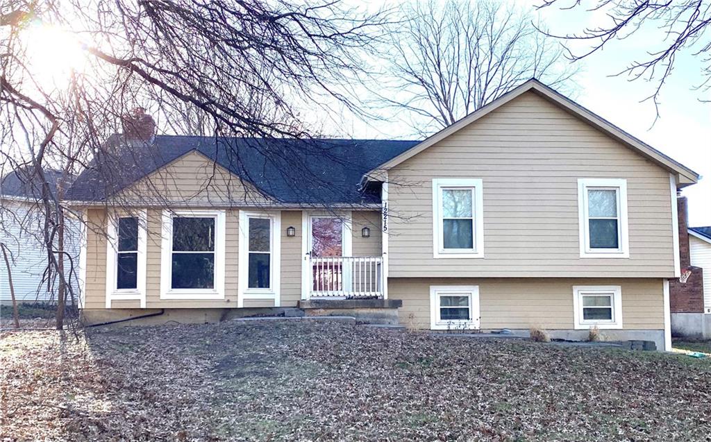 split level home with a chimney