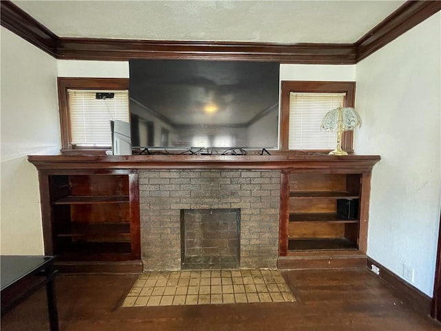 room details with a fireplace with flush hearth, crown molding, baseboards, and wood finished floors