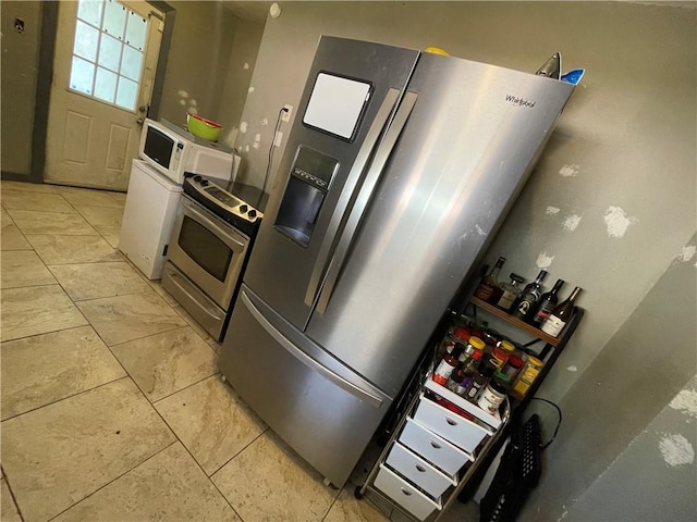 kitchen featuring stainless steel appliances and white cabinets