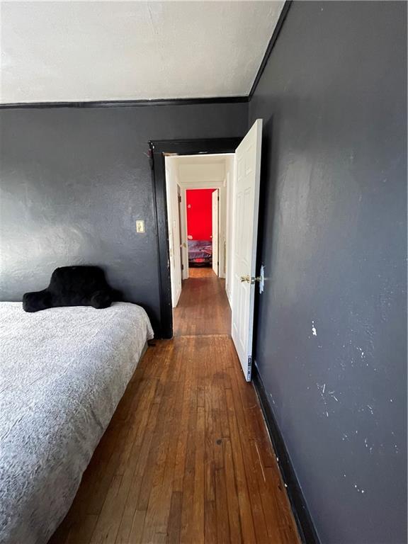 bedroom featuring wood-type flooring