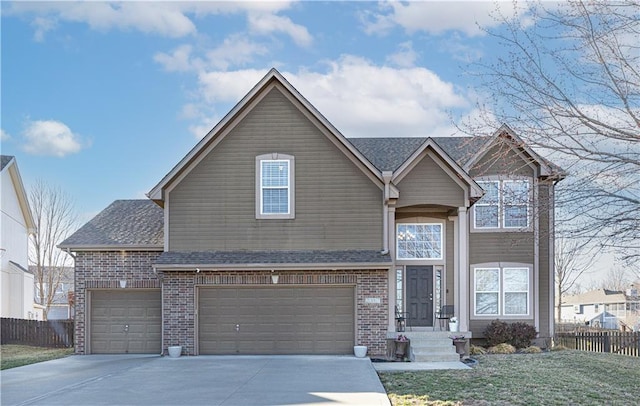 traditional-style home featuring fence, driveway, roof with shingles, an attached garage, and brick siding