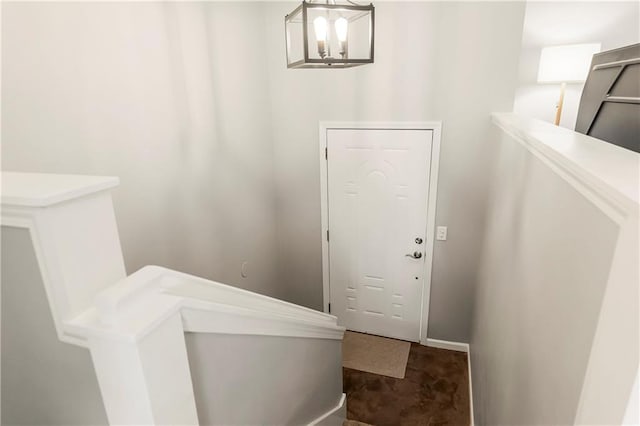 foyer featuring an inviting chandelier