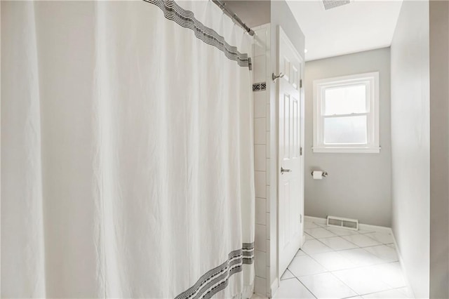 bathroom with tile patterned flooring, visible vents, and a shower with shower curtain