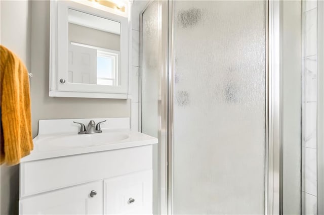 bathroom with vanity and a stall shower