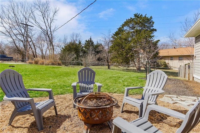 view of yard with a fenced backyard and an outdoor fire pit