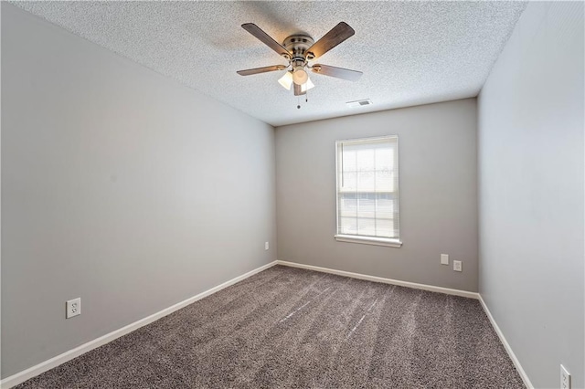 carpeted empty room featuring visible vents, baseboards, a textured ceiling, and ceiling fan