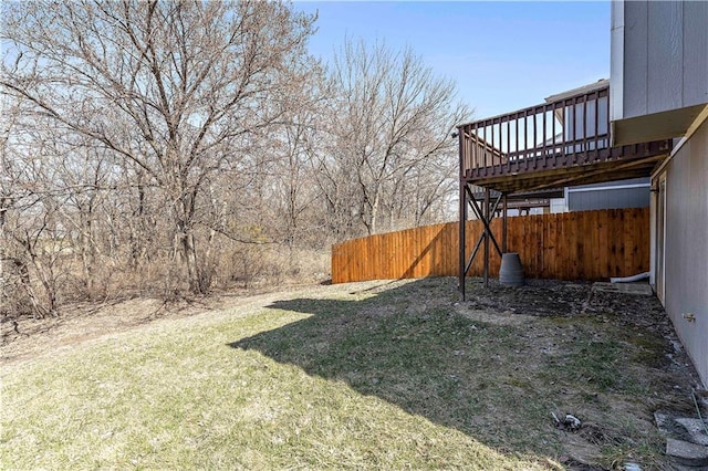 view of yard featuring a deck and fence