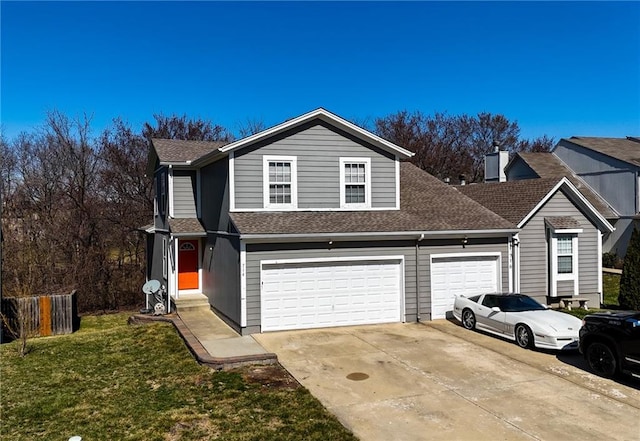 traditional-style home with roof with shingles, concrete driveway, an attached garage, a front yard, and a chimney