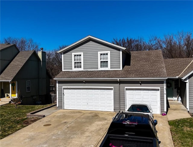 exterior space with driveway and a shingled roof