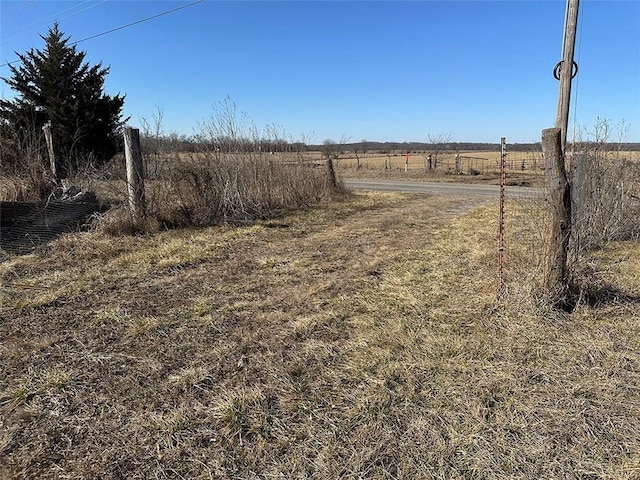 view of yard with a rural view