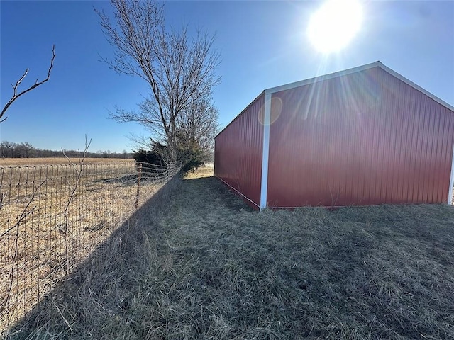 view of pole building with a rural view