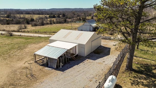 birds eye view of property featuring a rural view