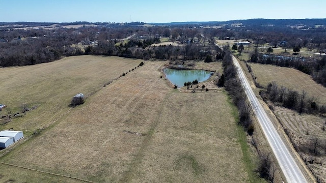 drone / aerial view with a rural view and a water view