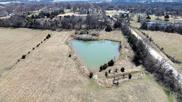 drone / aerial view with a water view and a rural view