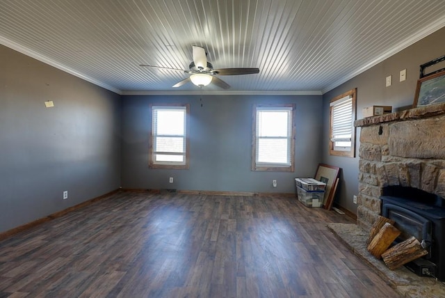 unfurnished living room featuring a wealth of natural light, wood finished floors, and crown molding