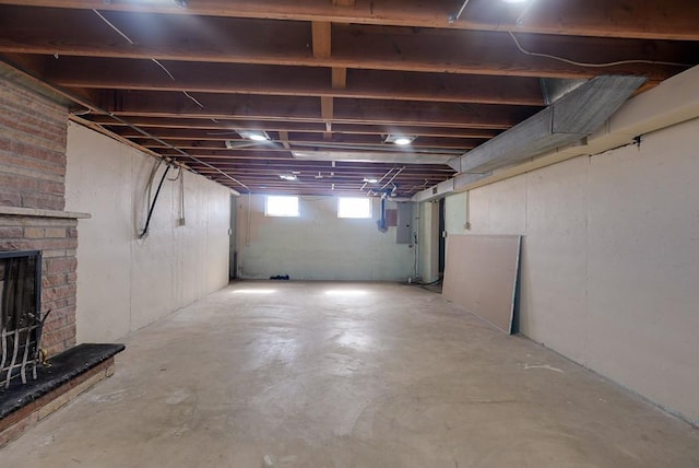 basement with a brick fireplace