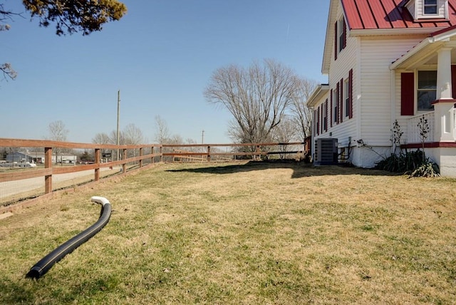 view of yard with cooling unit and fence