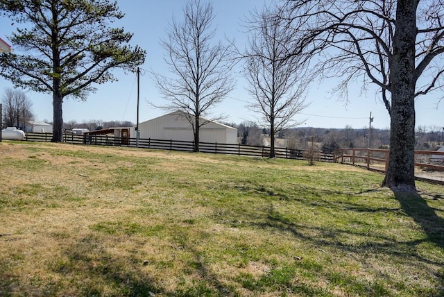 view of yard with a rural view and fence