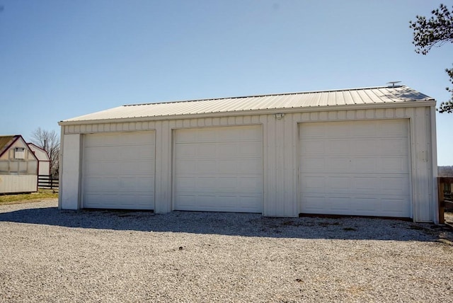 garage with fence