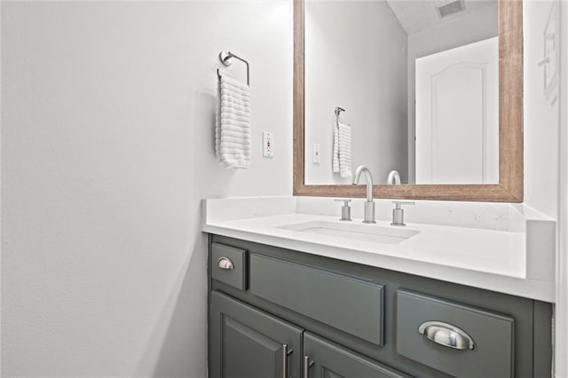 bathroom featuring vanity and visible vents